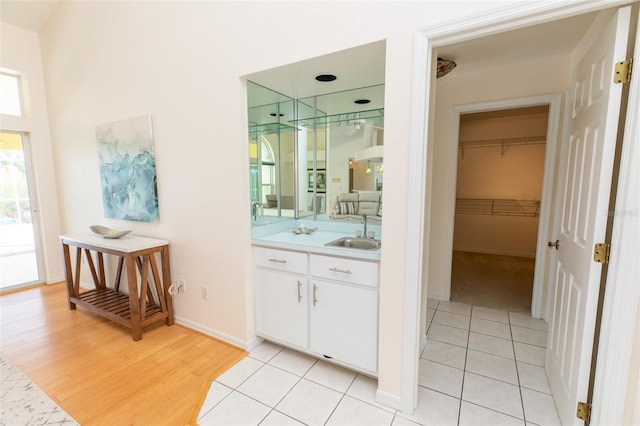 3506 Saint Florent Ct, Punta Gorda, FL 33950 - full bathroom featuring vanity, a spacious closet, wood finished floors, and a shower