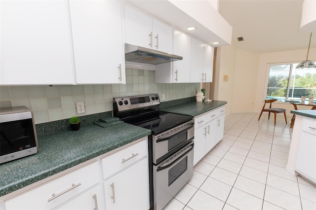 3506 Saint Florent Ct, Punta Gorda, FL 33950 - kitchen featuring stainless steel appliances, under cabinet range hood, dark countertops, and decorative backsplash