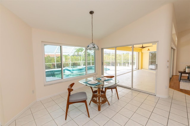 3506 Saint Florent Ct, Punta Gorda, FL 33950 - dining area featuring a sunroom, vaulted ceiling, plenty of natural light, and light tile patterned floors