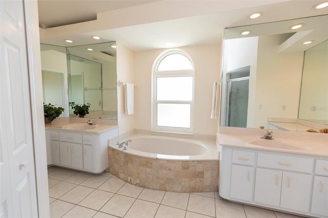 3506 Saint Florent Ct, Punta Gorda, FL 33950 - full bath with a garden tub, two vanities, a stall shower, tile patterned floors, and recessed lighting
