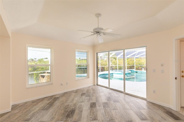 3506 Saint Florent Ct, Punta Gorda, FL 33950 - spare room with light wood-type flooring, a ceiling fan, plenty of natural light, and a sunroom