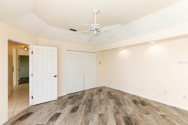 3506 Saint Florent Ct, Punta Gorda, FL 33950 - unfurnished bedroom featuring wood finished floors, a closet, a ceiling fan, and recessed lighting