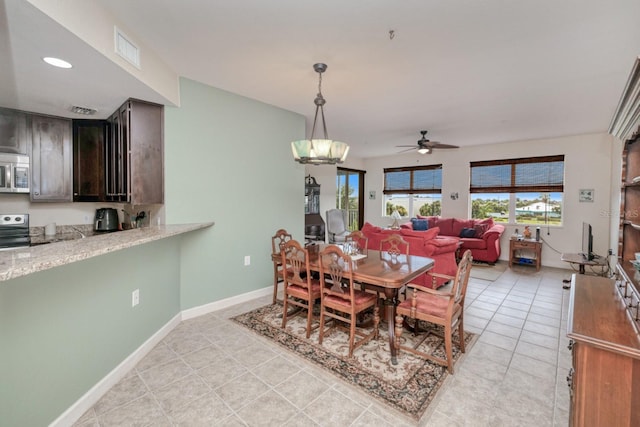 2001 Bal Harbor Blvd Unit 2306, Punta Gorda, FL 33950 - dining space featuring ceiling fan and light tile patterned floors