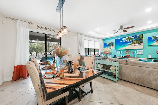 2515 Sherman Oak Dr, North Port, FL 34289 - dining area featuring light tile patterned floors, ceiling fan, recessed lighting, and a tray ceiling