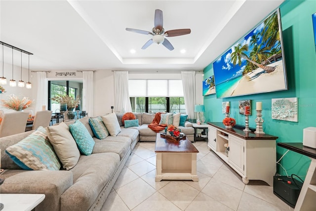 2515 Sherman Oak Dr, North Port, FL 34289 - living room featuring a ceiling fan, light tile patterned flooring, and a tray ceiling