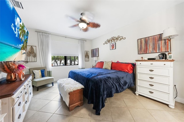 2515 Sherman Oak Dr, North Port, FL 34289 - bedroom with light tile patterned floors, a ceiling fan, and baseboards
