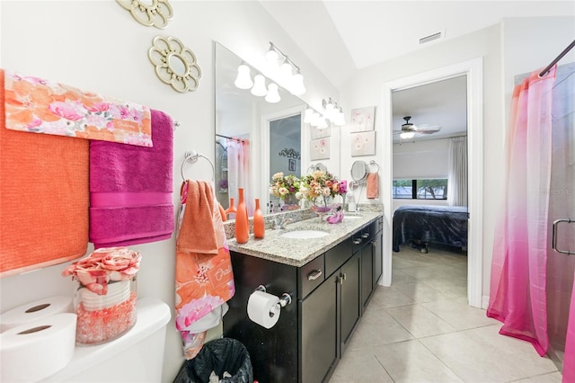 2515 Sherman Oak Dr, North Port, FL 34289 - ensuite bathroom with tile patterned floors, double vanity, a shower with shower curtain, and ceiling fan