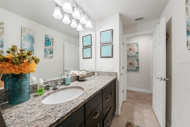 2515 Sherman Oak Dr, North Port, FL 34289 - bathroom featuring vanity, tile patterned floors, and baseboards
