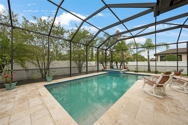 2515 Sherman Oak Dr, North Port, FL 34289 - view of swimming pool featuring a patio area, a fenced backyard, a pool with connected hot tub, and a lanai