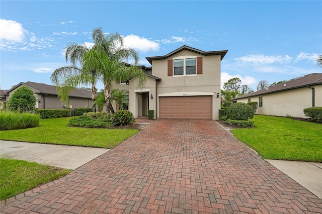 2515 Sherman Oak Dr, North Port, FL 34289 - traditional-style house featuring an attached garage, decorative driveway, stucco siding, and a front yard