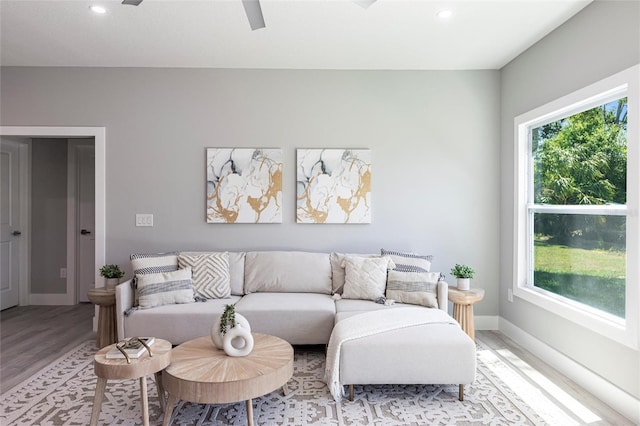 12168 Mayfair Ave, Port Charlotte, FL 33981 - living area with recessed lighting, light wood finished floors, and a ceiling fan