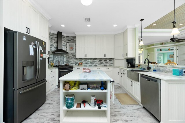 13204 Kakapo Ave, Port Charlotte, FL 33981 - kitchen featuring stainless steel appliances, wall chimney range hood, a sink, open shelves, and crown molding