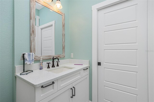 13204 Kakapo Ave, Port Charlotte, FL 33981 - bathroom with vanity and a textured wall