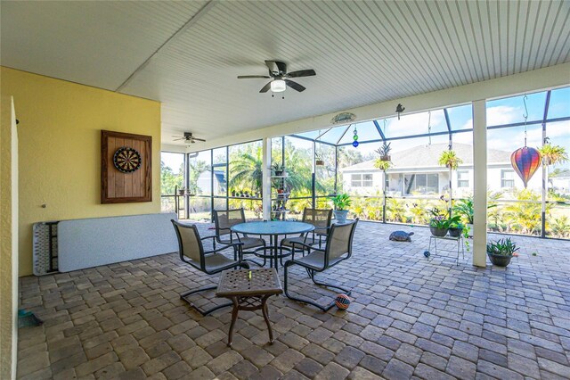 13204 Kakapo Ave, Port Charlotte, FL 33981 - view of patio featuring a ceiling fan, glass enclosure, and outdoor dining area