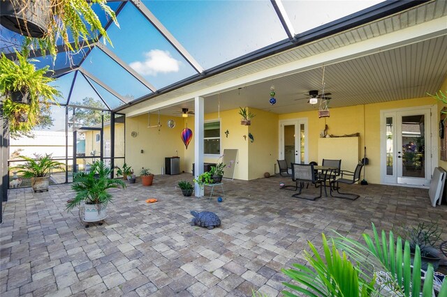 13204 Kakapo Ave, Port Charlotte, FL 33981 - view of patio with a ceiling fan, a lanai, and outdoor dining space