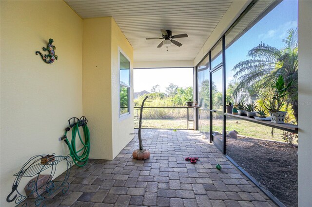 13204 Kakapo Ave, Port Charlotte, FL 33981 - unfurnished sunroom featuring ceiling fan