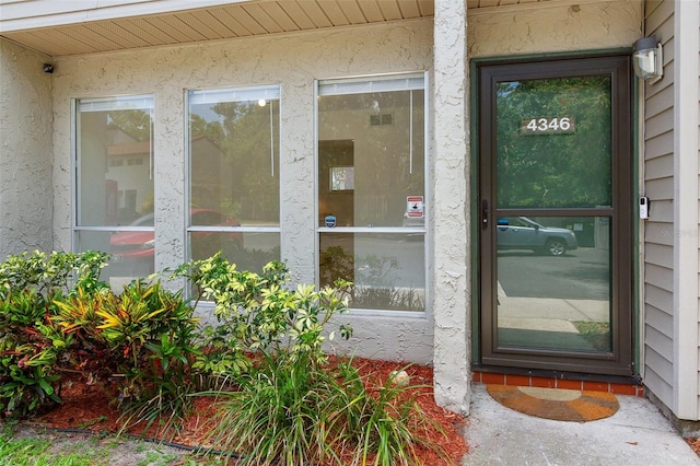 4346 Rayfield Dr Unit 4346, Sarasota, FL 34243 - doorway to property featuring stucco siding