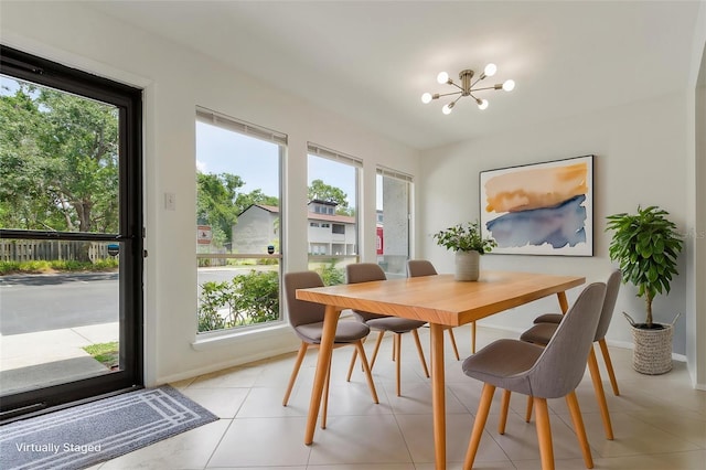 4346 Rayfield Dr Unit 4346, Sarasota, FL 34243 - dining room with a chandelier, baseboards, and light tile patterned floors