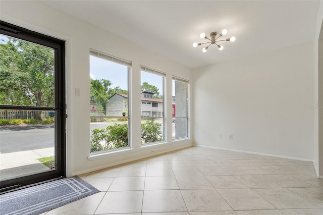 4346 Rayfield Dr Unit 4346, Sarasota, FL 34243 - unfurnished dining area featuring a chandelier, healthy amount of natural light, and baseboards