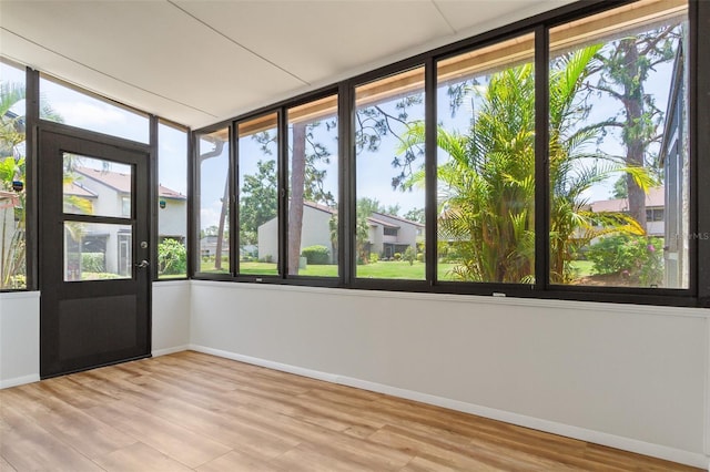 4346 Rayfield Dr Unit 4346, Sarasota, FL 34243 - unfurnished sunroom featuring baseboards and wood finished floors