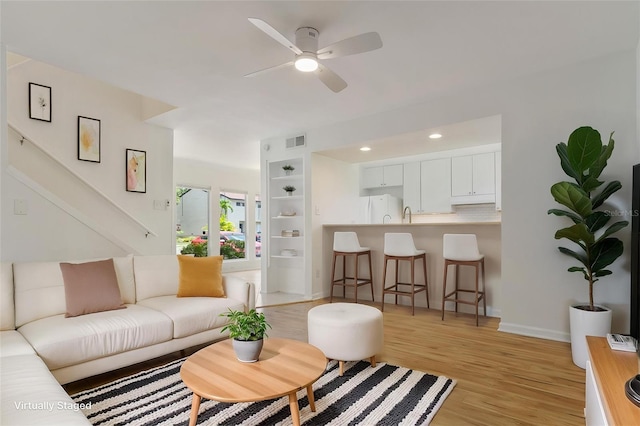 4346 Rayfield Dr Unit 4346, Sarasota, FL 34243 - living area featuring light wood-style flooring, a ceiling fan, baseboards, stairway, and recessed lighting