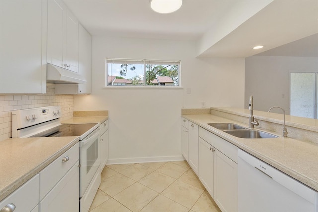4346 Rayfield Dr Unit 4346, Sarasota, FL 34243 - kitchen with white appliances, a sink, under cabinet range hood, white cabinetry, and backsplash