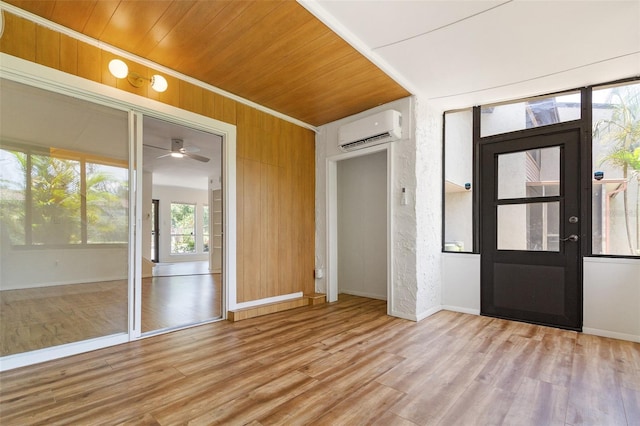 4346 Rayfield Dr Unit 4346, Sarasota, FL 34243 - entrance foyer featuring a wall mounted air conditioner, wood finished floors, ceiling fan, wooden ceiling, and baseboards