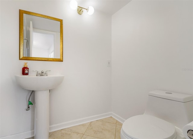 4346 Rayfield Dr Unit 4346, Sarasota, FL 34243 - bathroom with toilet, baseboards, and a sink