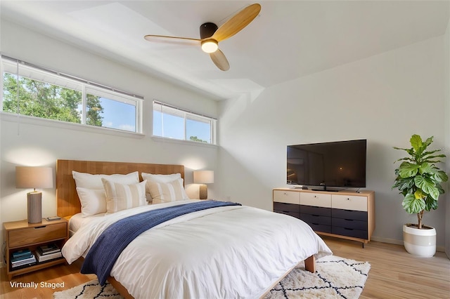 4346 Rayfield Dr Unit 4346, Sarasota, FL 34243 - bedroom with light wood finished floors, ceiling fan, and baseboards