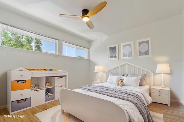 4346 Rayfield Dr Unit 4346, Sarasota, FL 34243 - bedroom with light wood finished floors, baseboards, and a ceiling fan