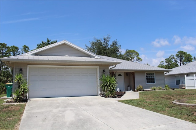 11422 2nd Ave, Punta Gorda, FL 33955 - ranch-style home featuring concrete driveway, a garage, a front lawn, and a metal roof