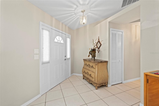 891 Bayard St, Port Charlotte, FL 33948 - entrance foyer featuring light tile patterned flooring and baseboards