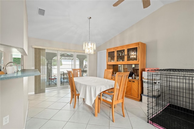 891 Bayard St, Port Charlotte, FL 33948 - dining room featuring a chandelier, light tile patterned floors, ceiling fan, and high vaulted ceiling