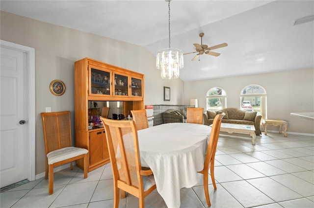 891 Bayard St, Port Charlotte, FL 33948 - dining space featuring light tile patterned floors, lofted ceiling, a chandelier, ceiling fan, and baseboards