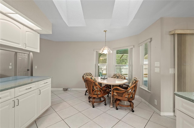 891 Bayard St, Port Charlotte, FL 33948 - dining space featuring baseboards, light tile patterned flooring, and a skylight
