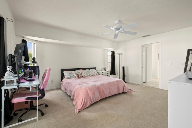 891 Bayard St, Port Charlotte, FL 33948 - bedroom with light carpet, an office area, ceiling fan, and baseboards