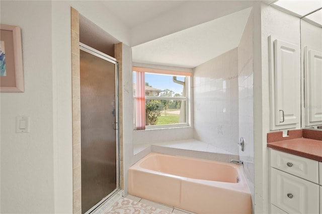 891 Bayard St, Port Charlotte, FL 33948 - bathroom with a bath, a shower stall, vanity, and tile patterned floors
