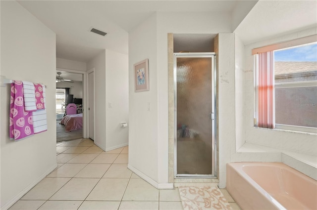 891 Bayard St, Port Charlotte, FL 33948 - bathroom with a bath, a shower stall, ensuite bathroom, and tile patterned floors
