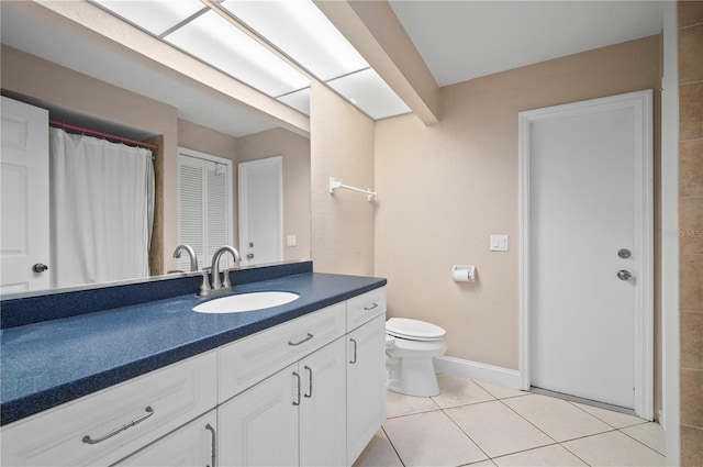 891 Bayard St, Port Charlotte, FL 33948 - full bath featuring vanity, toilet, tile patterned floors, and baseboards