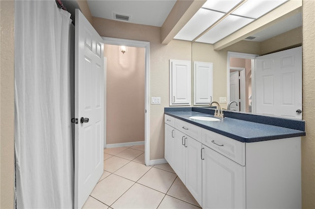 891 Bayard St, Port Charlotte, FL 33948 - bathroom featuring vanity, tile patterned floors, and baseboards