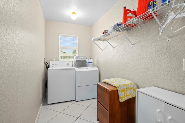 891 Bayard St, Port Charlotte, FL 33948 - laundry room featuring a textured wall, separate washer and dryer, and light tile patterned flooring