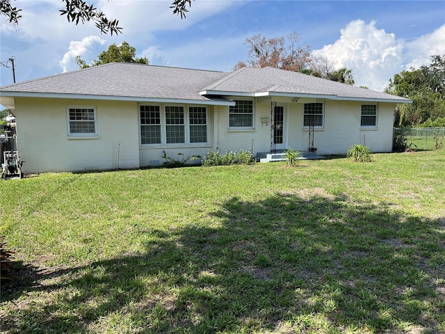 404 W Whidden St, Arcadia, FL 34266 - back of house featuring stucco siding and a shingled roof