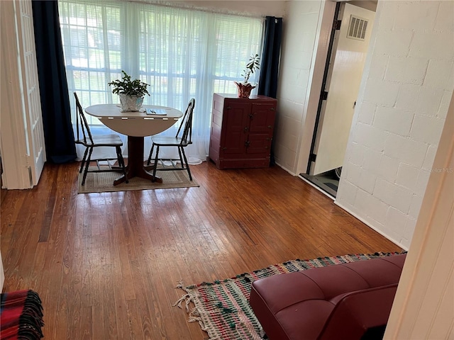 404 W Whidden St, Arcadia, FL 34266 - dining room with hardwood / wood-style floors and concrete block wall