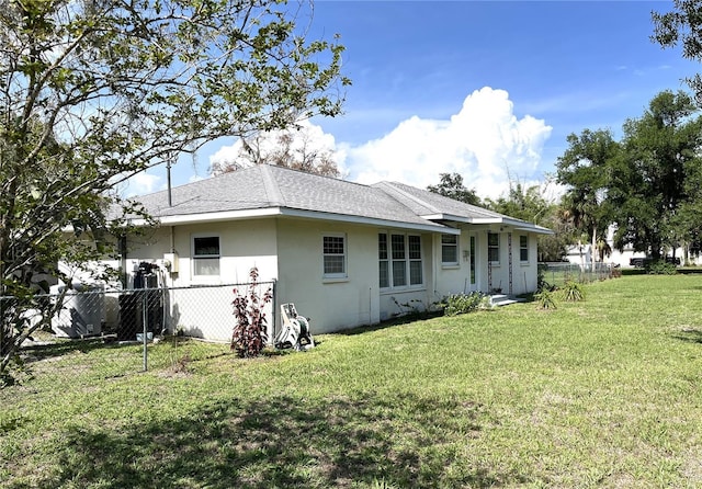 404 W Whidden St, Arcadia, FL 34266 - back of house with stucco siding and a shingled roof