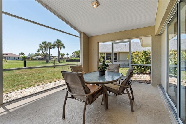 7334 N Tulip Tree, Punta Gorda, FL 33955 - sunroom / solarium with vaulted ceiling, plenty of natural light, and outdoor dining space