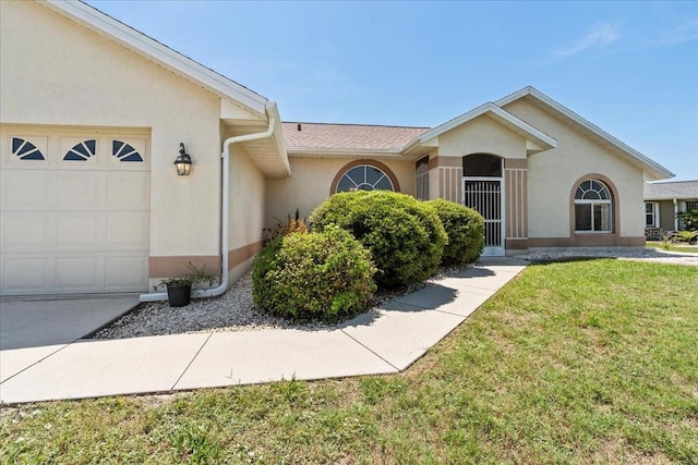 7334 N Tulip Tree, Punta Gorda, FL 33955 - ranch-style home with stucco siding, a garage, and a front lawn