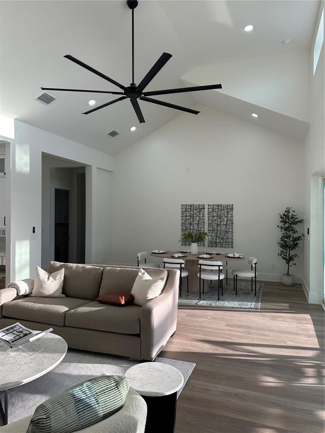 3548 Mondovi Ct, Punta Gorda, FL 33950 - living area featuring high vaulted ceiling, wood finished floors, recessed lighting, and ceiling fan