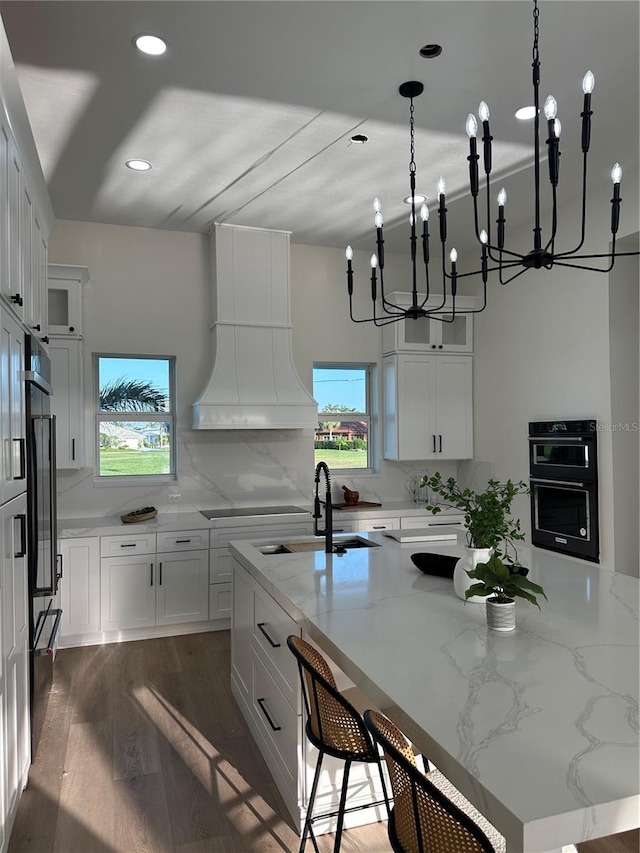 3548 Mondovi Ct, Punta Gorda, FL 33950 - kitchen featuring a sink, custom exhaust hood, a chandelier, plenty of natural light, and recessed lighting