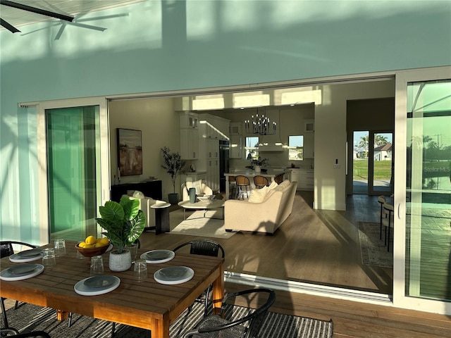3548 Mondovi Ct, Punta Gorda, FL 33950 - dining space with wood finished floors, a chandelier, and ceiling fan