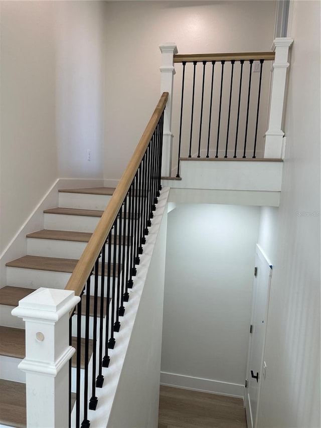 3548 Mondovi Ct, Punta Gorda, FL 33950 - stairs featuring wood finished floors and baseboards
